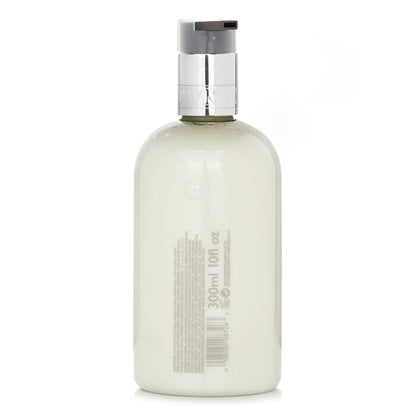 Molton Brown Lotion pour les mains Délicieuse Rhubarbe & Rose 300ml/10oz